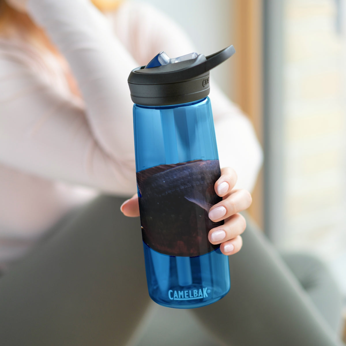 Red Black CamelBak Eddy® Water Bottle in 20oz and 25oz sizes, showcasing its durable design and spill-proof valve.