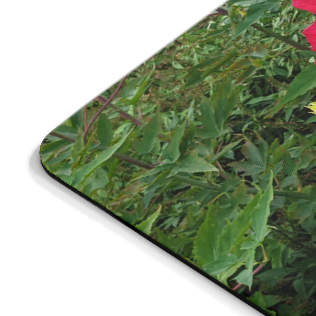 A vibrant red flowers mouse pad featuring a smooth surface and non-slip backing, perfect for enhancing any desk decor.
