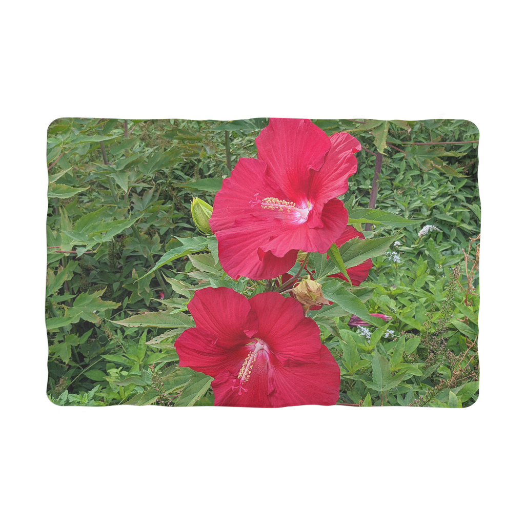 A cozy red flowers sublimation pet blanket made of soft polar fleece, perfect for pets to snuggle on beds or in cars.