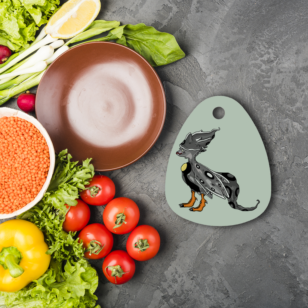 Rerann Sublimation Glass Cutting Board in water droplet shape, featuring a smooth surface and rubber feet for stability.