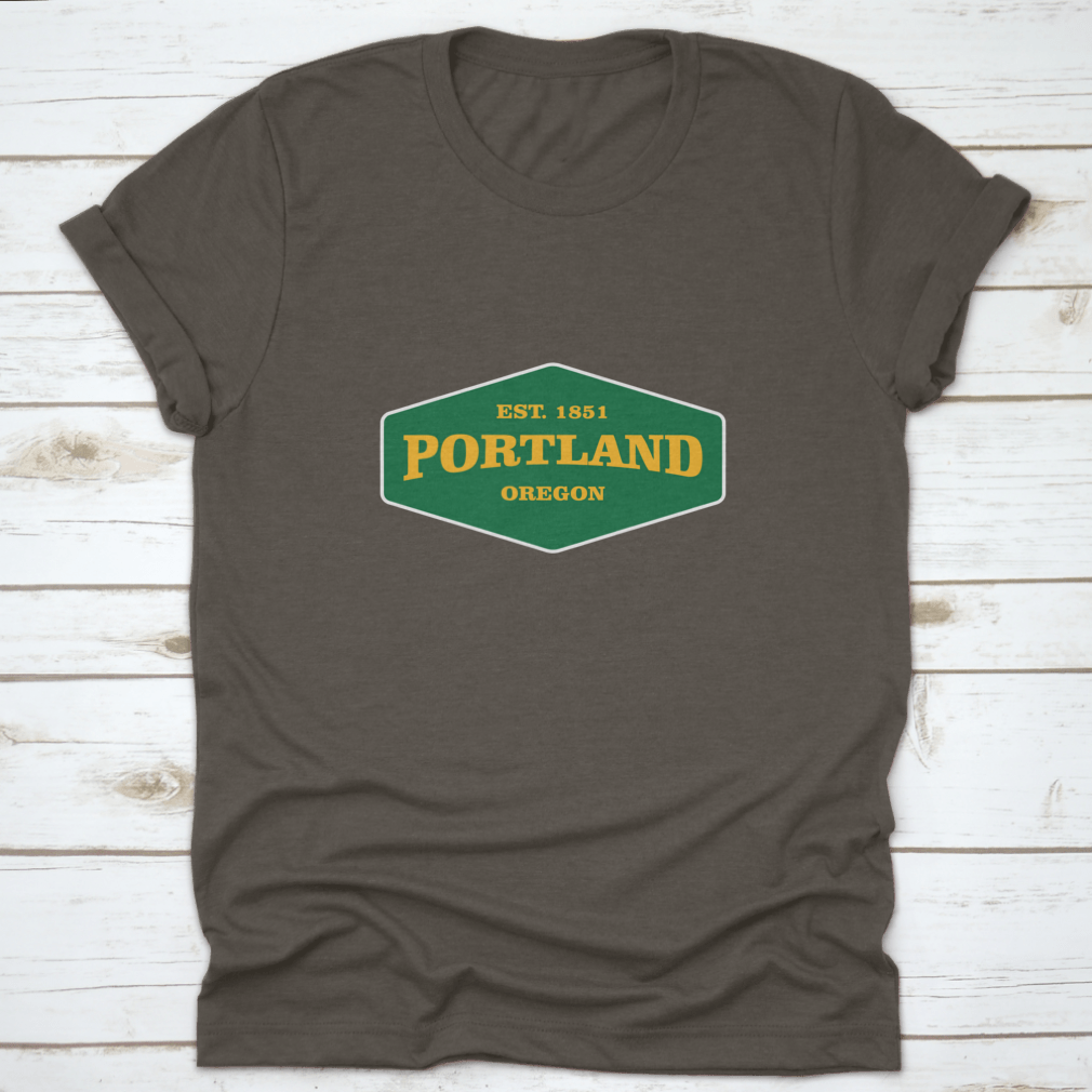 Retro Badge Portland T-shirt featuring a unique graphic design, made from 100% cotton for comfort and durability.