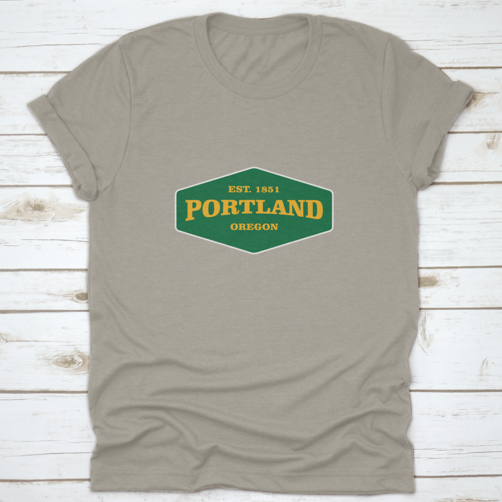 Retro Badge Portland T-shirt featuring a unique graphic design, made from 100% cotton for comfort and durability.