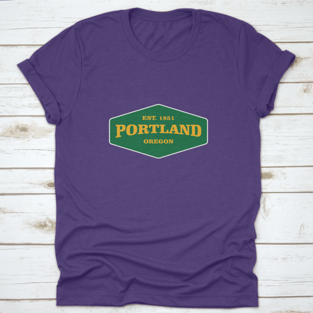 Retro Badge Portland T-shirt featuring a unique graphic design, made from 100% cotton for comfort and durability.