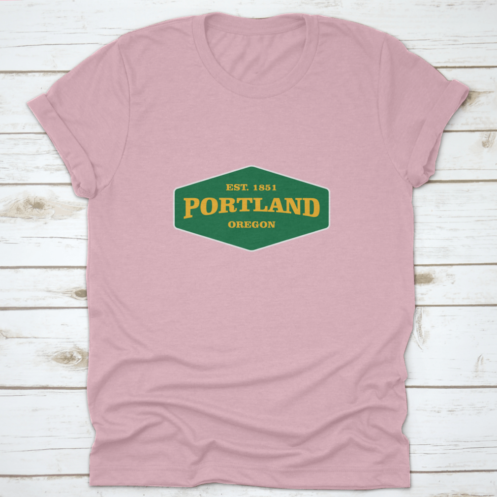 Retro Badge Portland T-shirt featuring a unique graphic design, made from 100% cotton for comfort and durability.