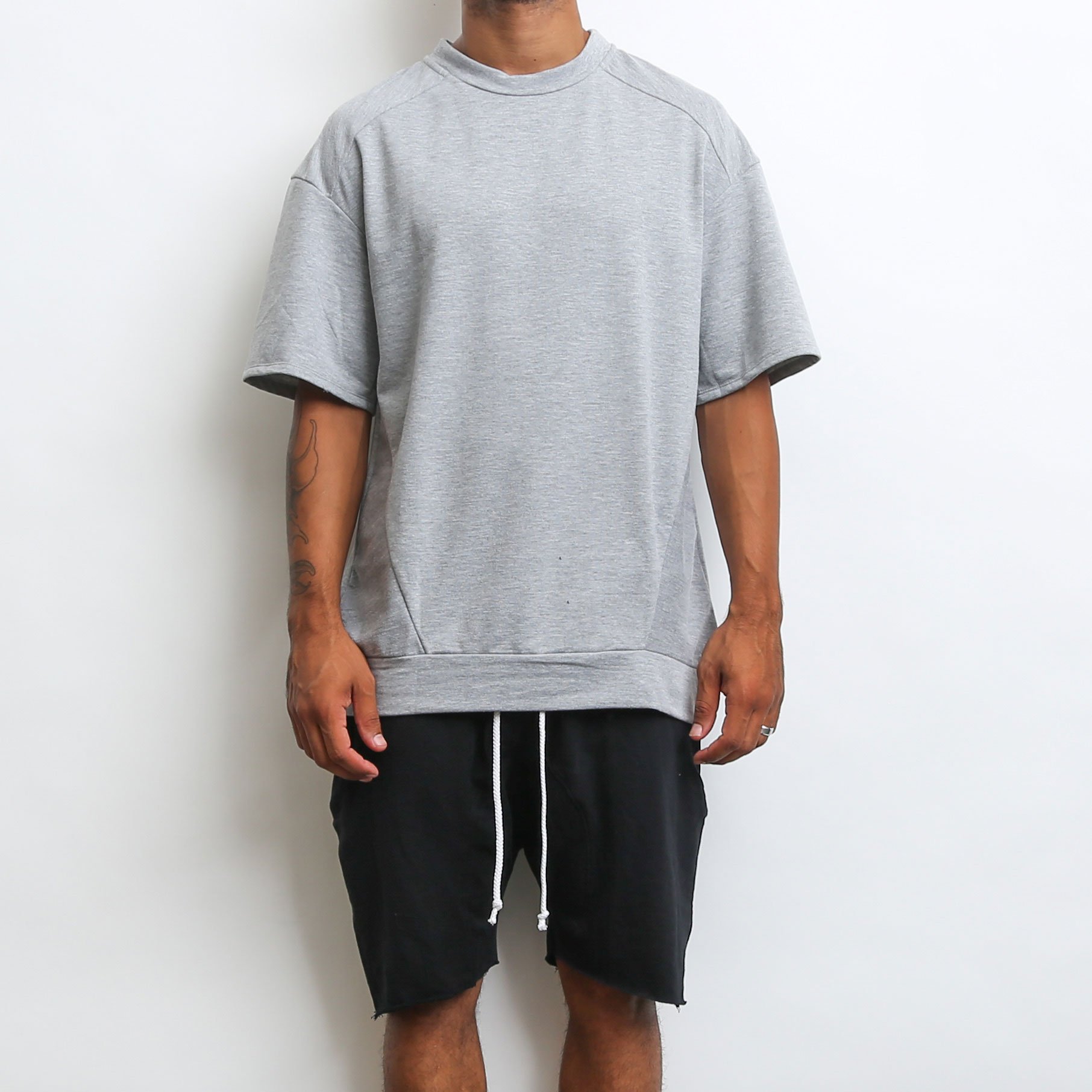 A stylish grey oversized 1/2 sleeve tee made from 100% cotton, perfect for casual wear.