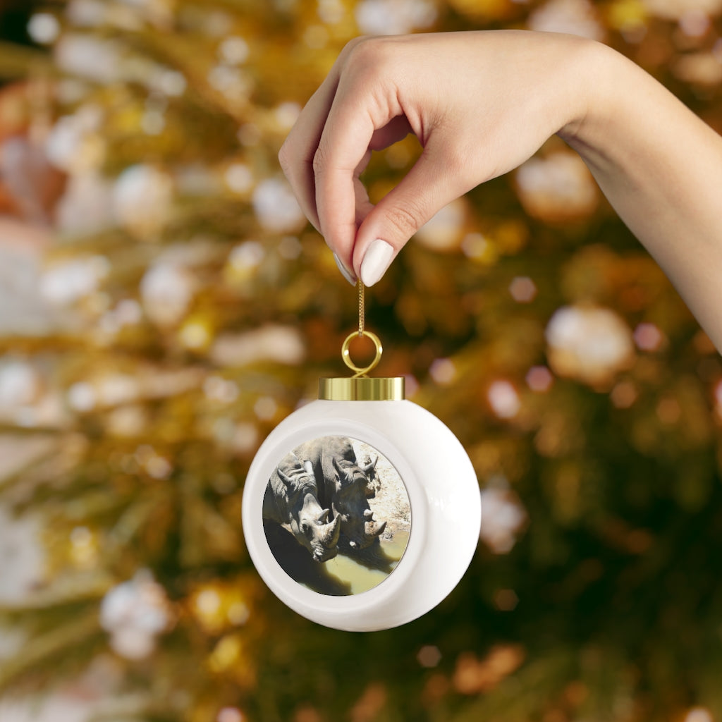 A 3-inch Rhinos Christmas Ball Ornament with a glossy finish and gold ribbon, featuring a vintage design and custom metal insert.