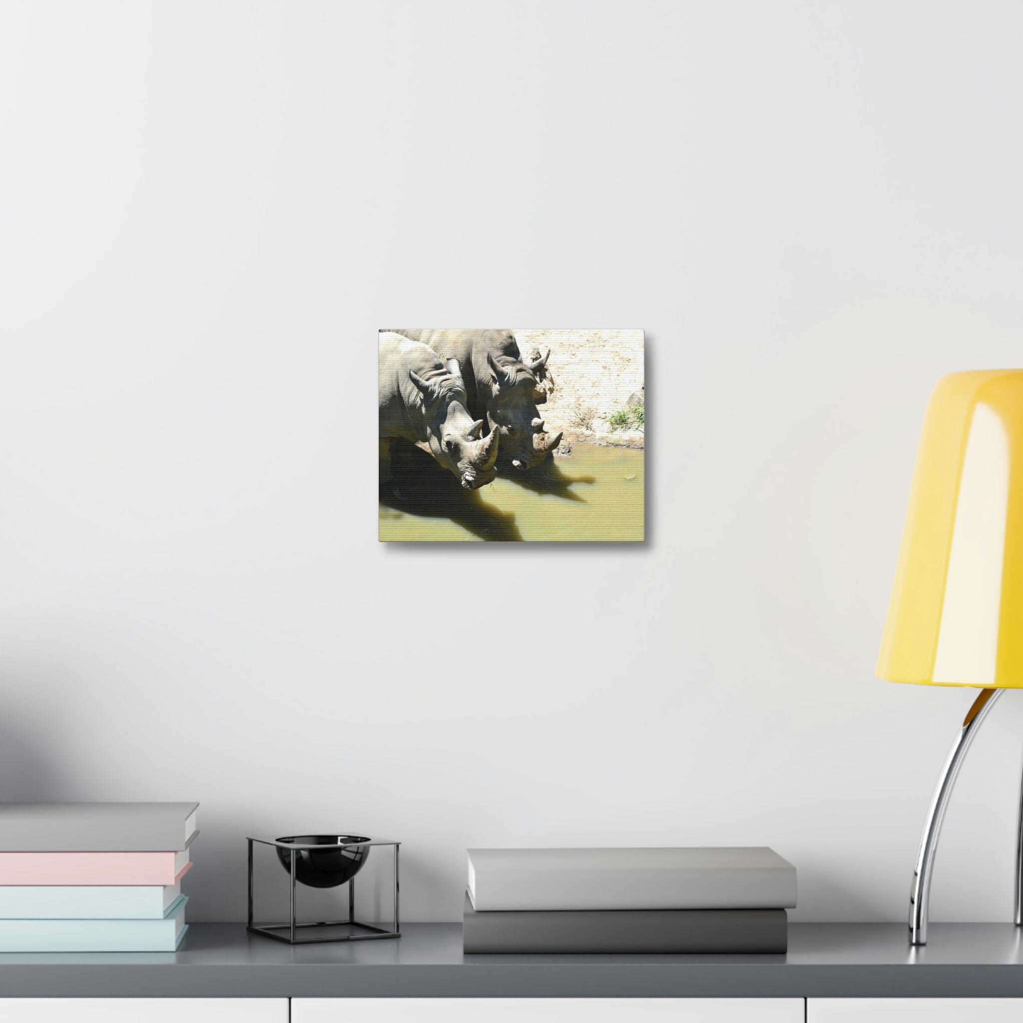 Rhinos Stretched Canvas artwork featuring vibrant colors and intricate details, mounted on a sturdy wooden frame.