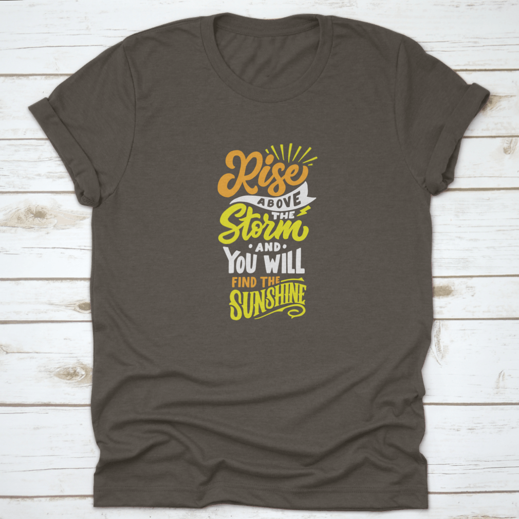 A comfortable cotton t-shirt featuring the inspiring quote 'Rise Above The Storm And You Will Find The Sunshine' in a stylish design.