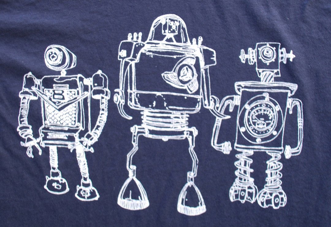 Robot Horizon Heather Black T-Shirt featuring retro robot design in white ink on a soft black fabric.