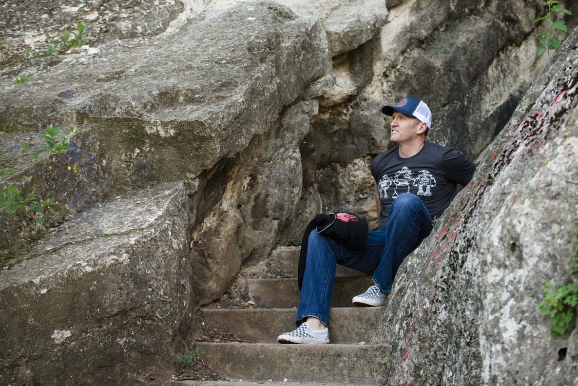 Robot Horizon Heather Black T-Shirt featuring retro robot design in white ink on a soft black fabric.