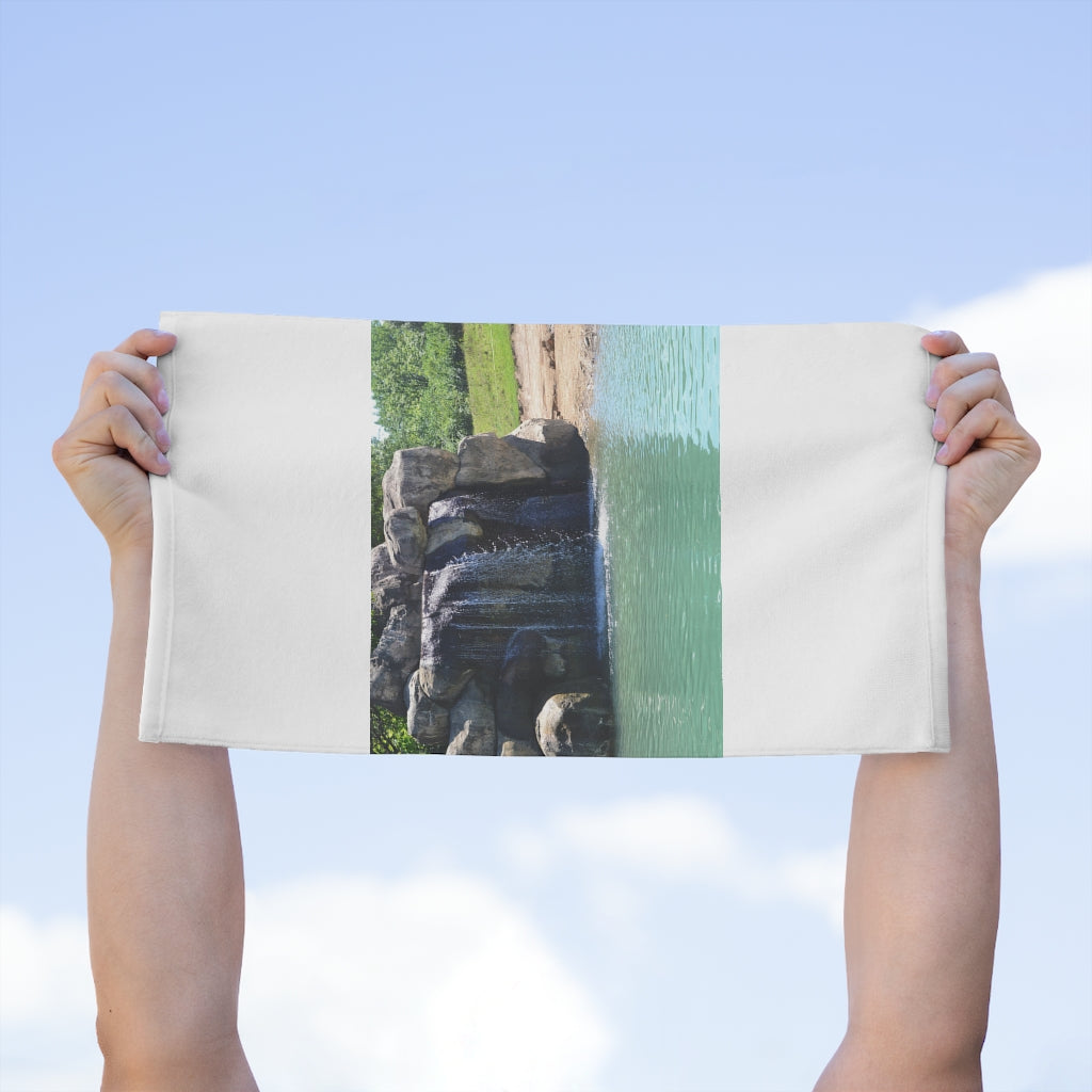 Rock Waterfall Rally Towel measuring 11x18 inches, featuring a soft printed mink polyester front and absorbent cotton loop backing.