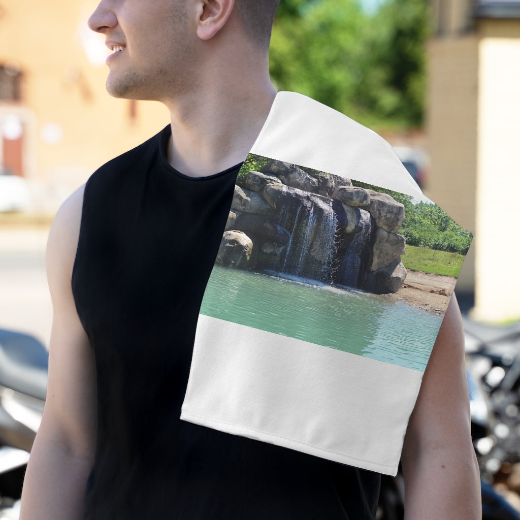 Rock Waterfall Rally Towel measuring 11x18 inches, featuring a soft printed mink polyester front and absorbent cotton loop backing.