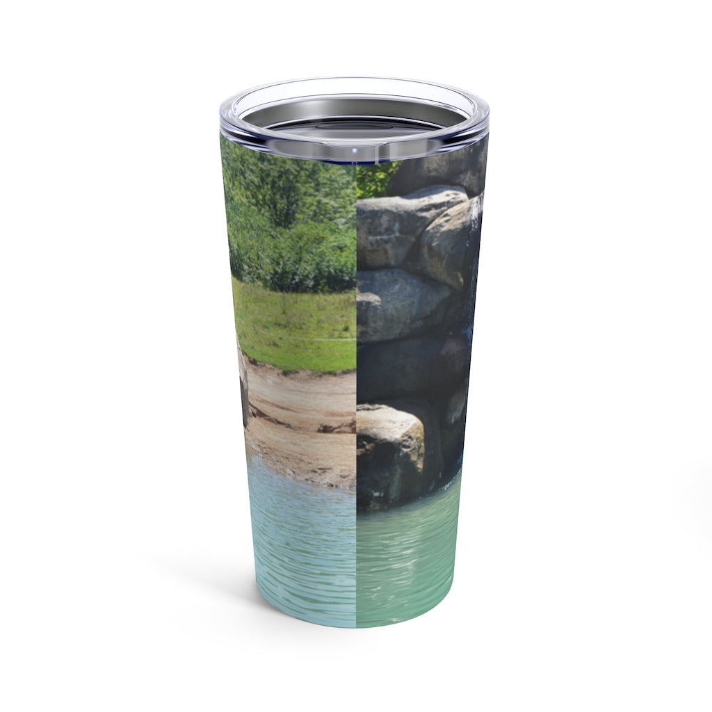 Rock Waterfall Tumbler 20oz in stainless steel with a see-thru plastic lid, showcasing its sleek design and rounded corners.