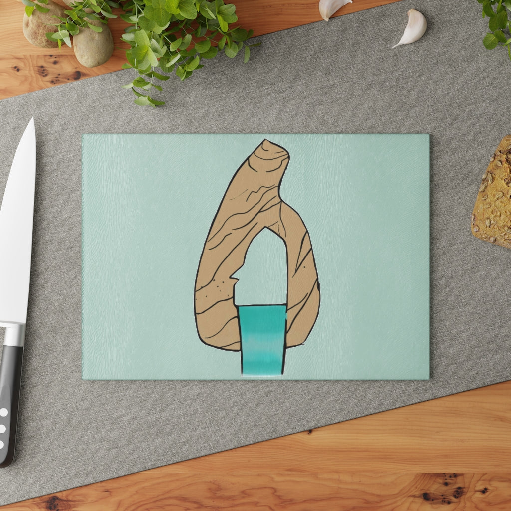 Rock with Water Glass Cutting Board featuring a textured surface and rubber stability dots, available in two sizes.