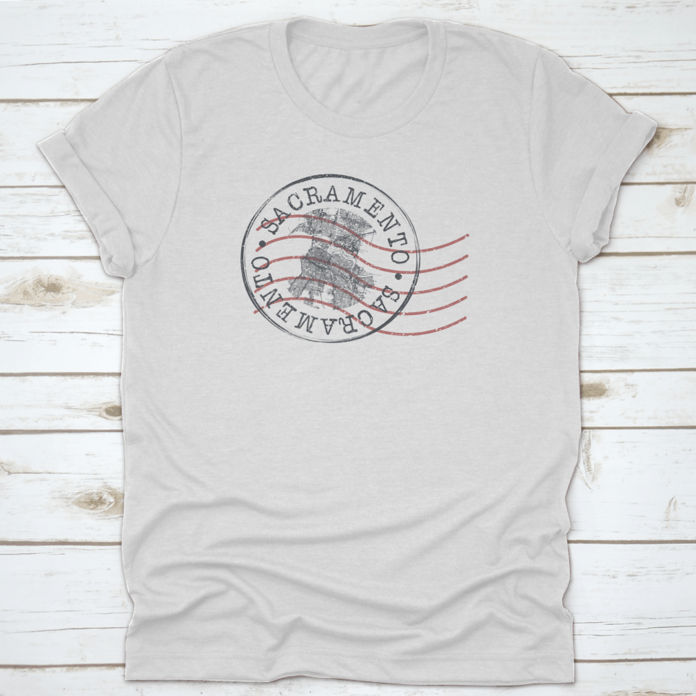 Sacramento, CA Stamp Map Postal T-shirt featuring a unique silhouette design of the city's roads and landmarks.