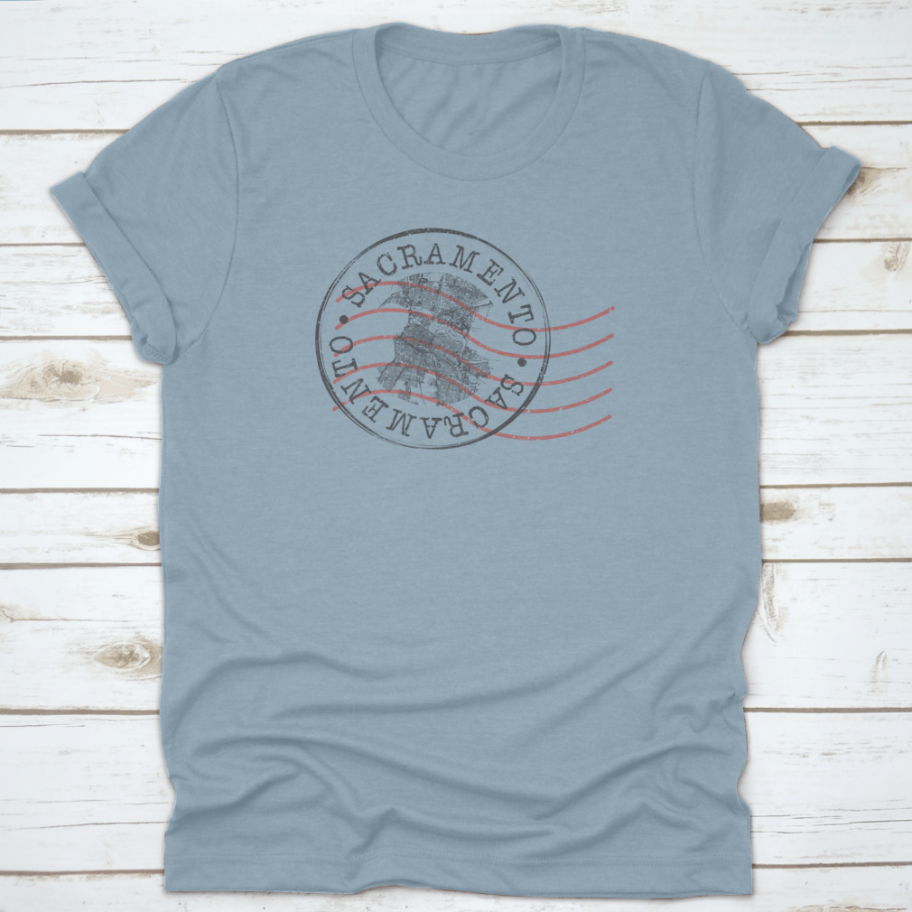 Sacramento, CA Stamp Map Postal T-shirt featuring a unique silhouette design of the city's roads and landmarks.