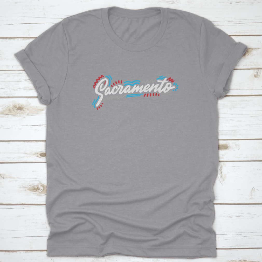 Sacramento Handwritten City Name design on a stylish cotton garment, showcasing modern calligraphy.