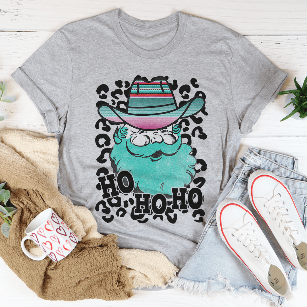 A festive Santa Cowboy T-Shirt featuring a playful design with Santa dressed as a cowboy, made from soft cotton.