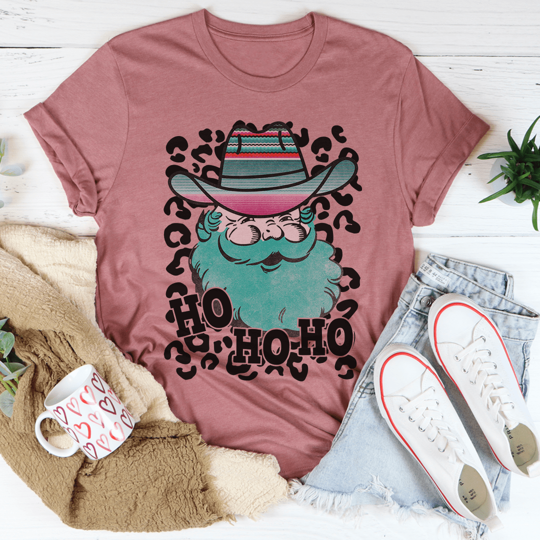 A festive Santa Cowboy T-Shirt featuring a playful design with Santa dressed as a cowboy, made from soft cotton.