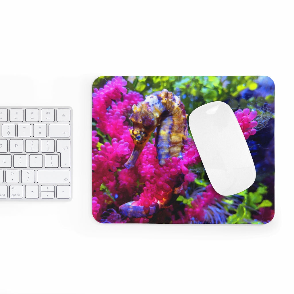 A colorful seahorse mouse pad featuring a vibrant design on a smooth neoprene surface, perfect for enhancing any desk.