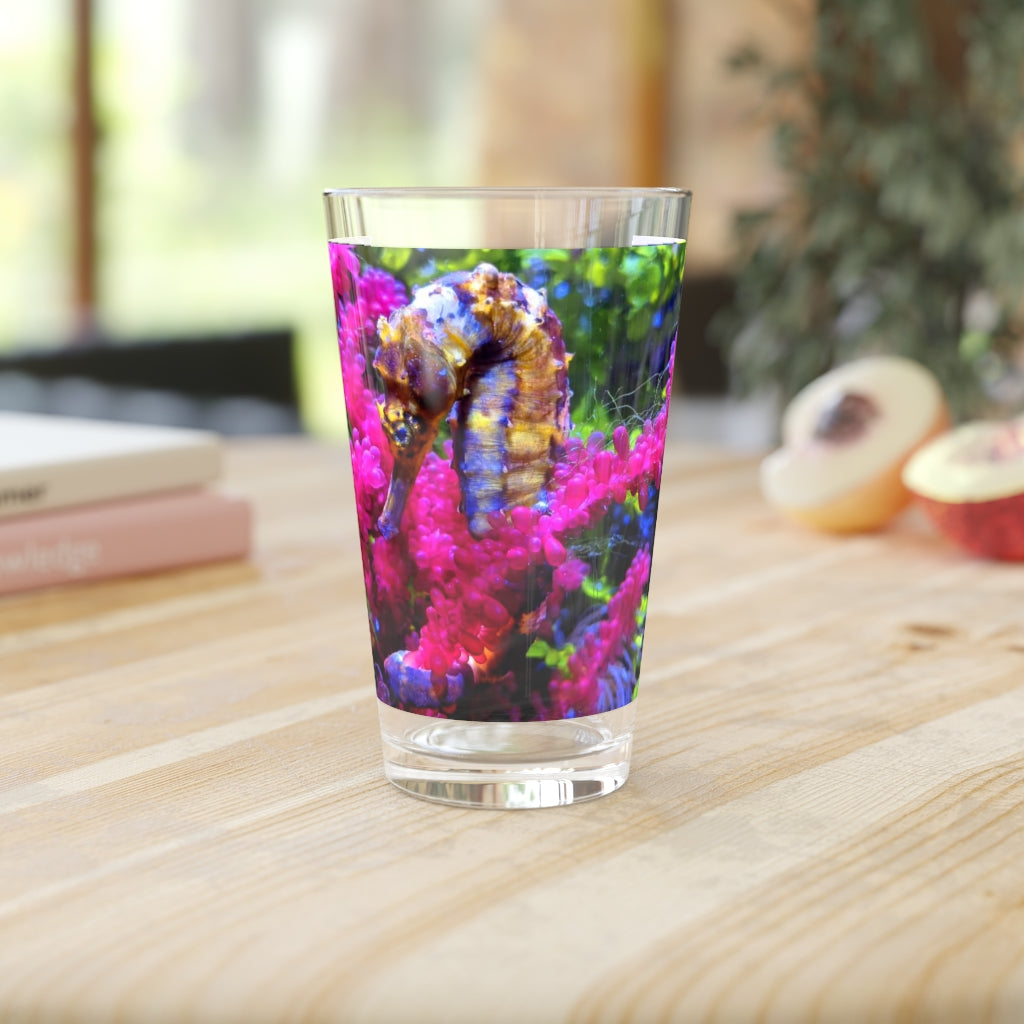 A clear 16oz Seahorse Pint Glass showcasing a unique design, perfect for beverages.