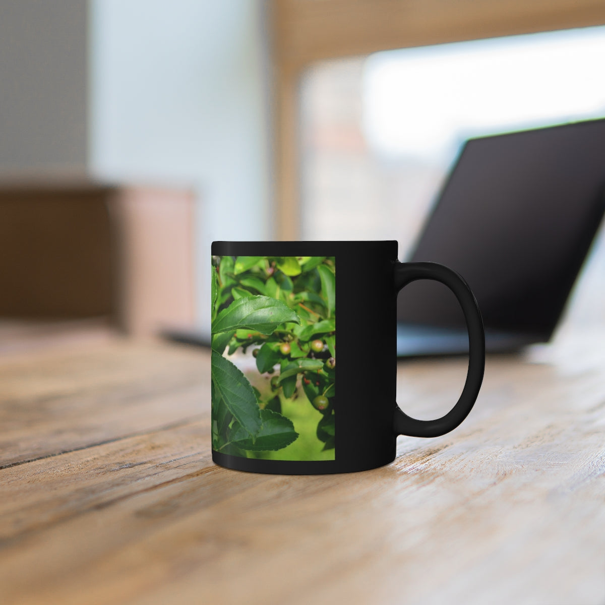 A stylish 11oz black ceramic mug with a C-handle, perfect for coffee, tea, or hot chocolate, featuring customizable designs.