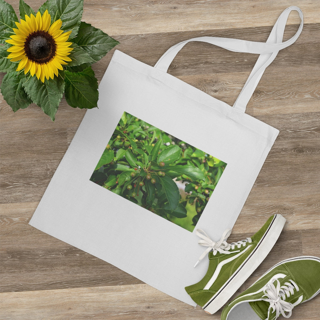 Seeds and Green Leaves Tote Bag made of 100% cotton with long handles and cross stitching for stability, available in multiple colors.