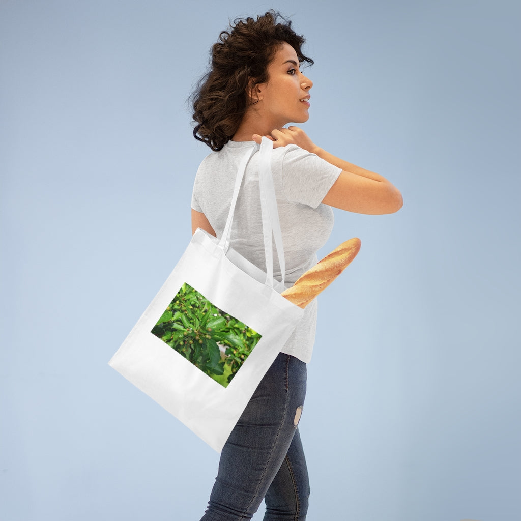 Seeds and Green Leaves Tote Bag made of 100% cotton with long handles and cross stitching for stability, available in multiple colors.
