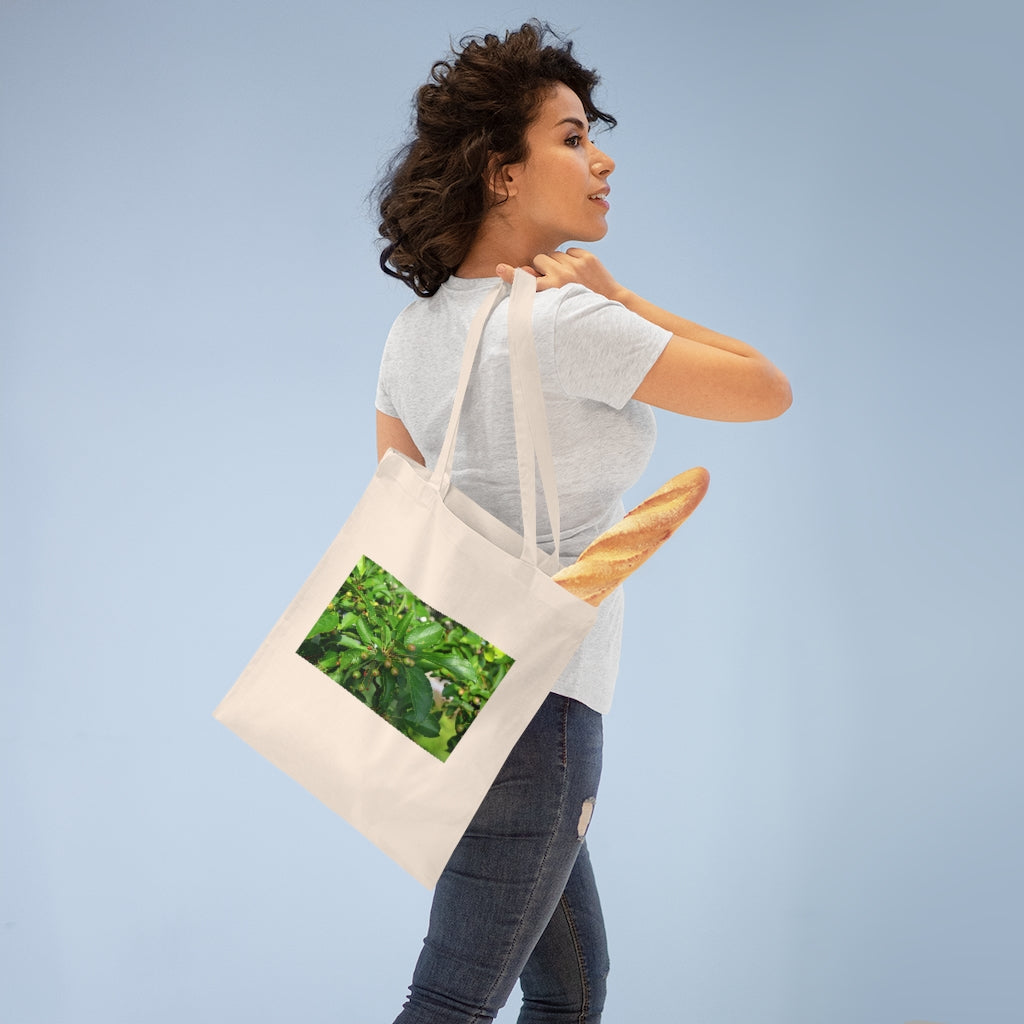 Seeds and Green Leaves Tote Bag made of 100% cotton with long handles and cross stitching for stability, available in multiple colors.