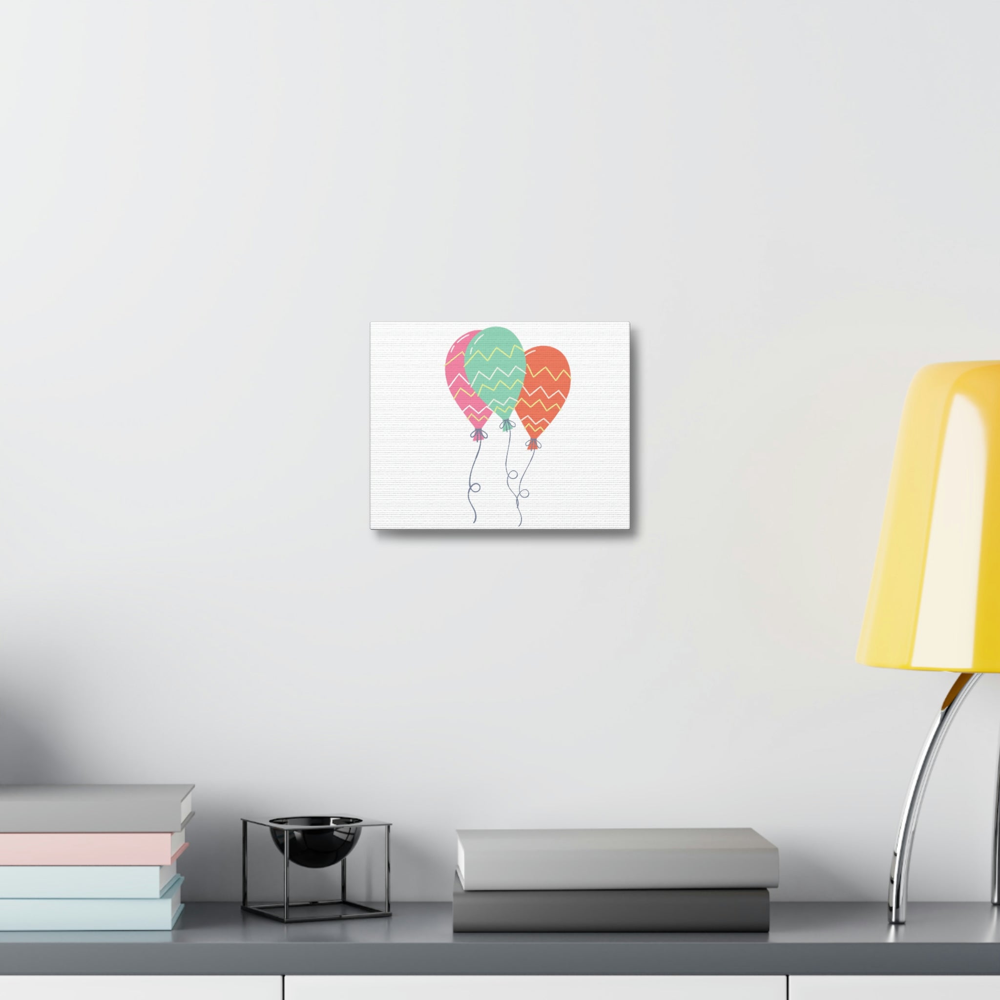 A vibrant set of balloons printed on a stretched canvas, showcasing bright colors and detailed designs, perfect for indoor decoration.