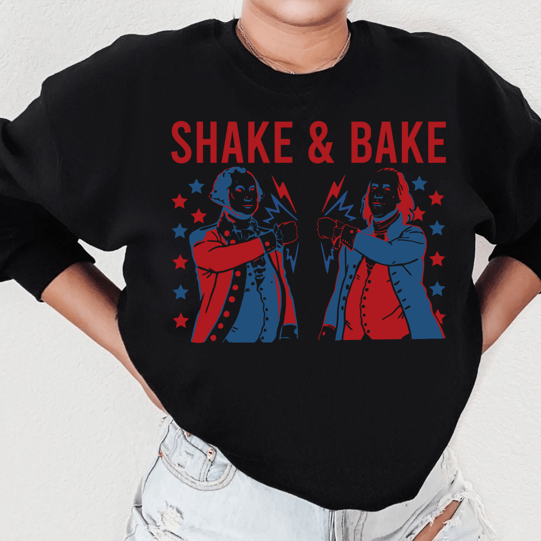 A cozy cotton/poly fleece hoodie from Shake & Bake, featuring unique designs by top artists, perfect for casual wear.