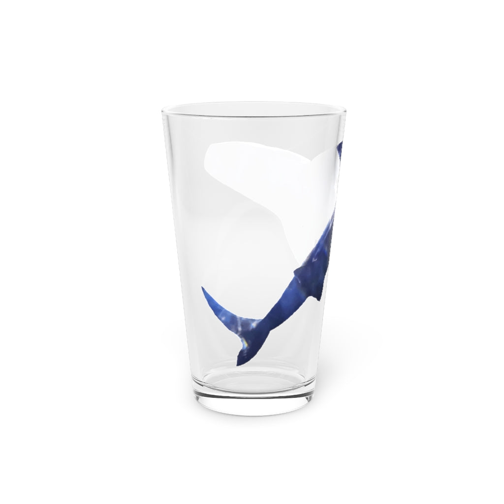 A clear 16oz Shark Pint Glass showcasing a custom printed design, ideal for beverages.