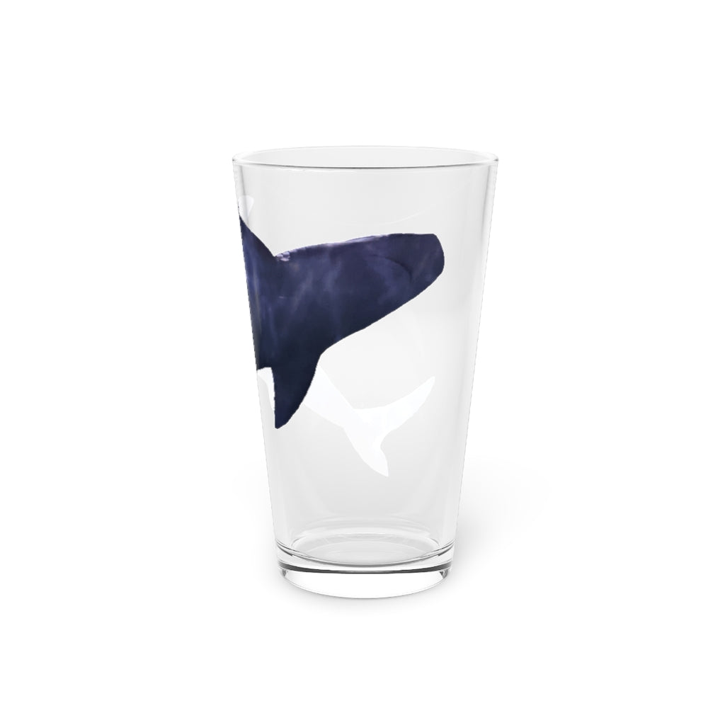 A clear 16oz Shark Pint Glass showcasing a custom printed design, ideal for beverages.