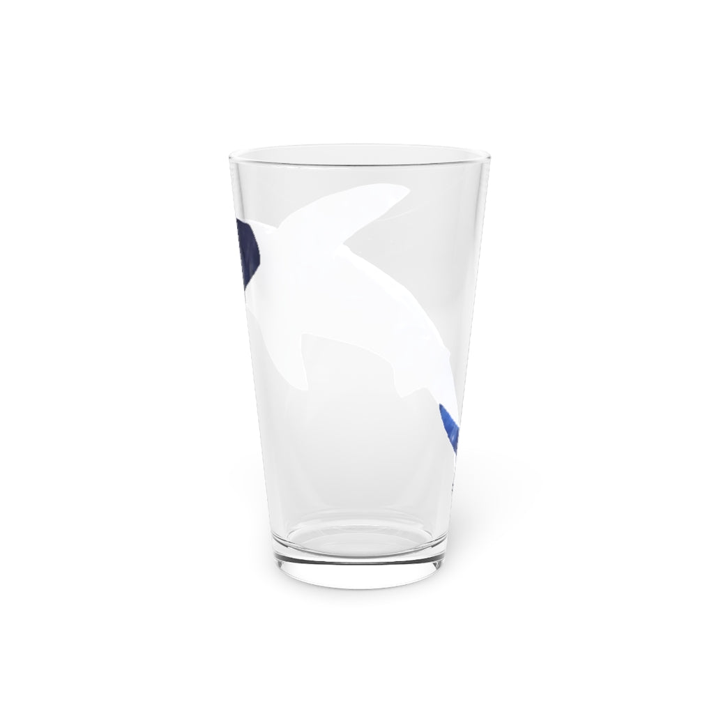 A clear 16oz Shark Pint Glass showcasing a custom printed design, ideal for beverages.