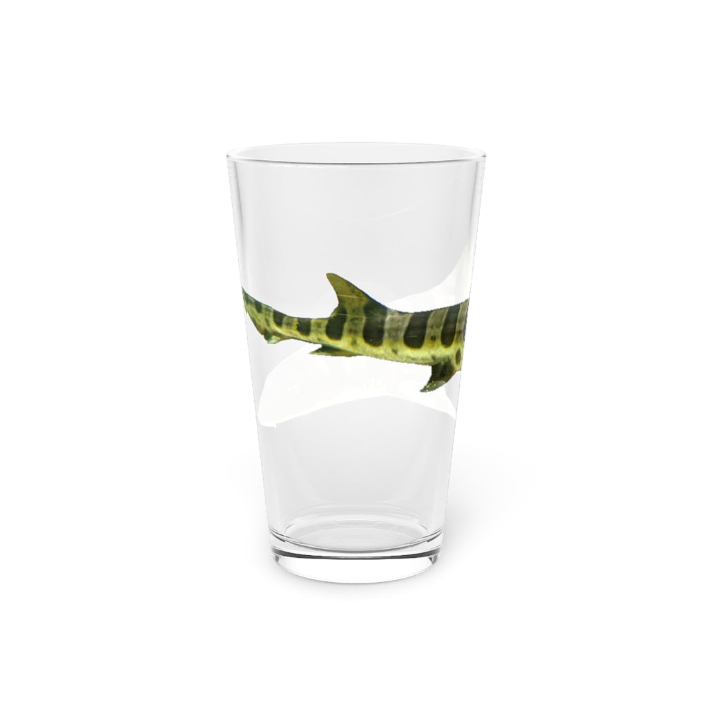 A clear 16oz Shark Pint Glass showcasing a customizable design, perfect for beverages.