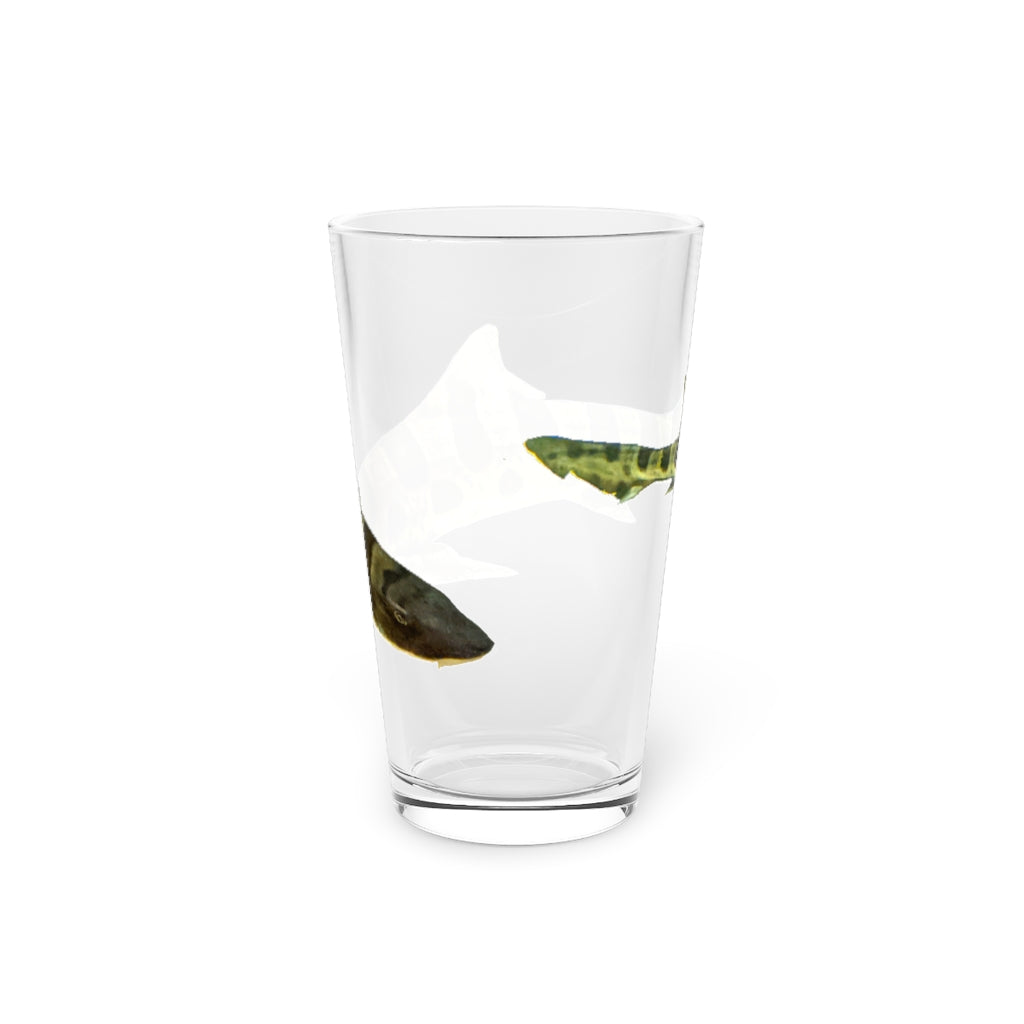 A clear 16oz Shark Pint Glass showcasing a customizable design, perfect for beverages.