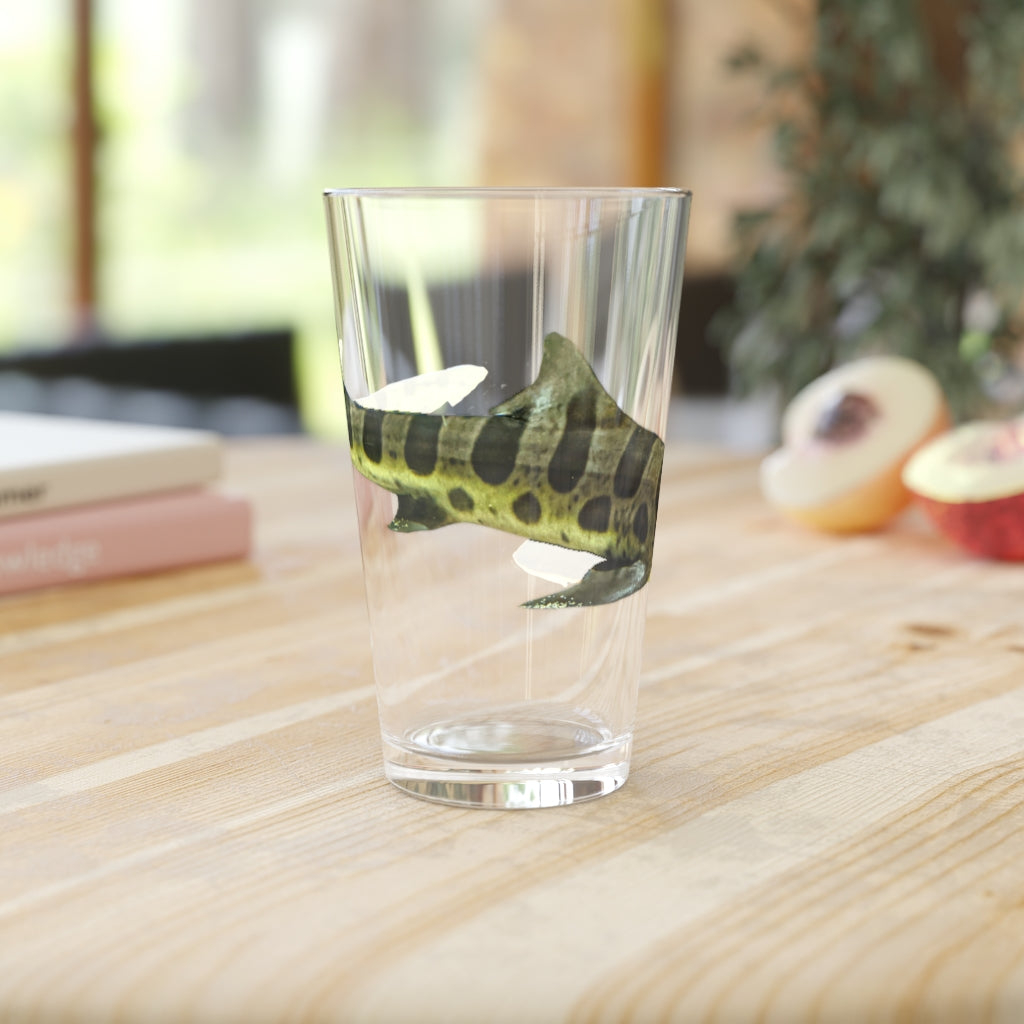 A clear 16oz Shark Pint Glass showcasing a customizable design, perfect for beverages.