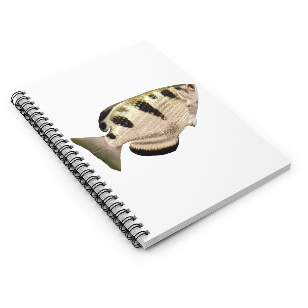 Silver and black spiral notebook featuring a fish design on the front cover, with ruled line pages inside.