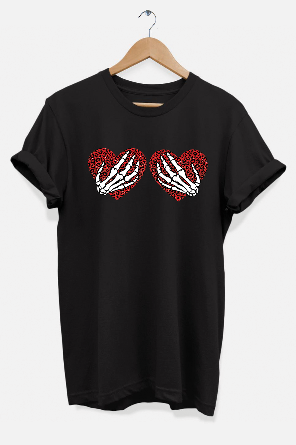 A stylish unisex t-shirt featuring a graphic of skeleton hands over a heart, made from soft ring-spun cotton.