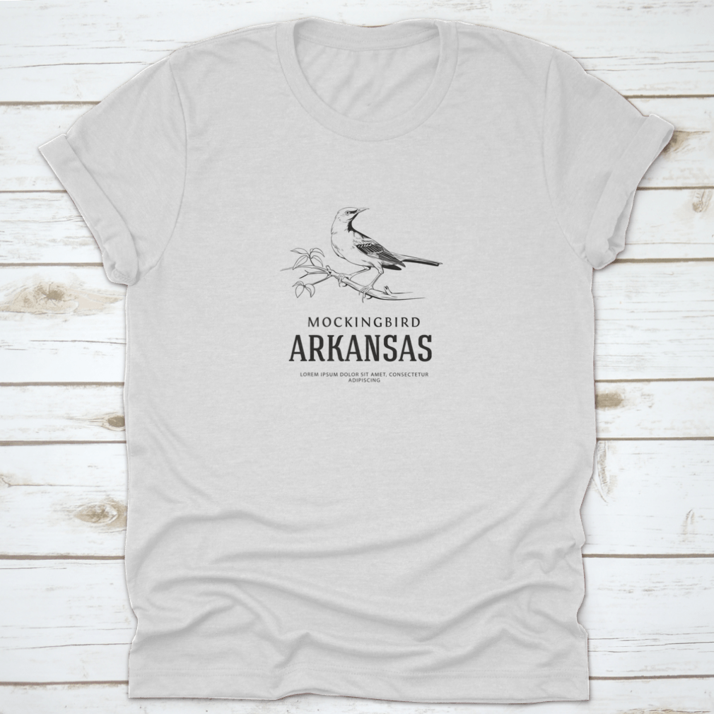 Vintage logo shirt featuring a sketch of a Nightingale Mockingbird, representing Arkansas state bird, made from soft cotton.