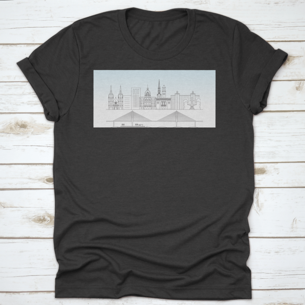A stylish t-shirt featuring a sketch of Savannah, Georgia's skyline with a food stand and sandy beach, showcasing vibrant colors and artistic details.