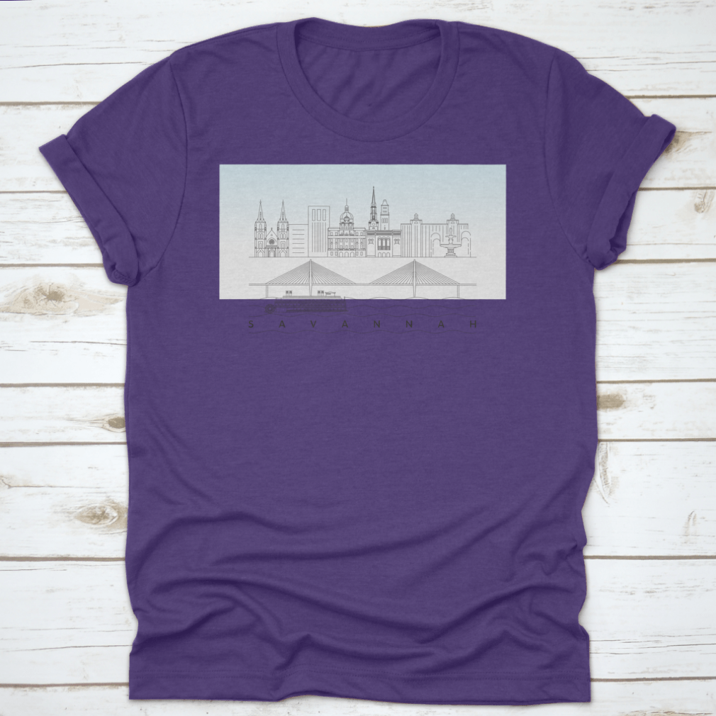 A stylish t-shirt featuring a sketch of Savannah, Georgia's skyline with a food stand and sandy beach, showcasing vibrant colors and artistic details.