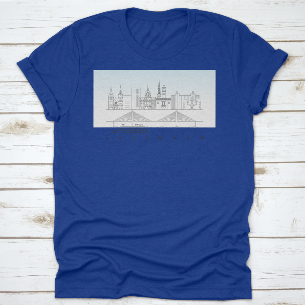 A stylish t-shirt featuring a sketch of Savannah, Georgia's skyline with a food stand and sandy beach, showcasing vibrant colors and artistic details.