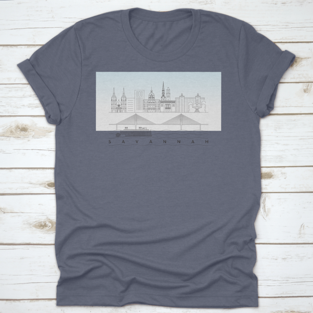 A stylish t-shirt featuring a sketch of Savannah, Georgia's skyline with a food stand and sandy beach, showcasing vibrant colors and artistic details.