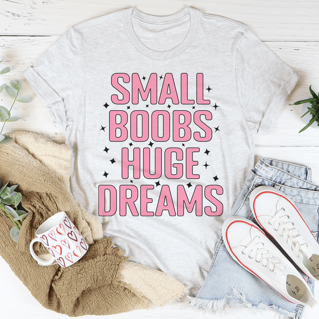 A stylish Small Boobs Huge Dreams T-Shirt made from soft cotton, featuring a humorous slogan and durable stitching.