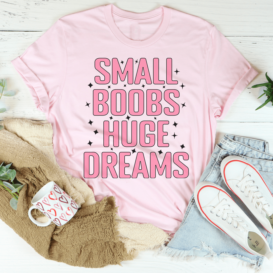 A stylish Small Boobs Huge Dreams T-Shirt made from soft cotton, featuring a humorous slogan and durable stitching.