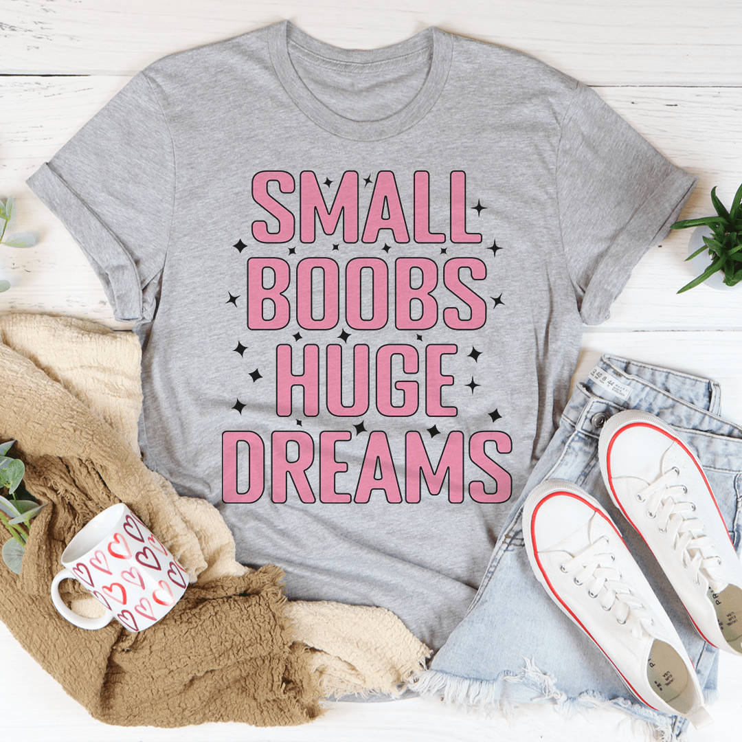 A stylish Small Boobs Huge Dreams T-Shirt made from soft cotton, featuring a humorous slogan and durable stitching.