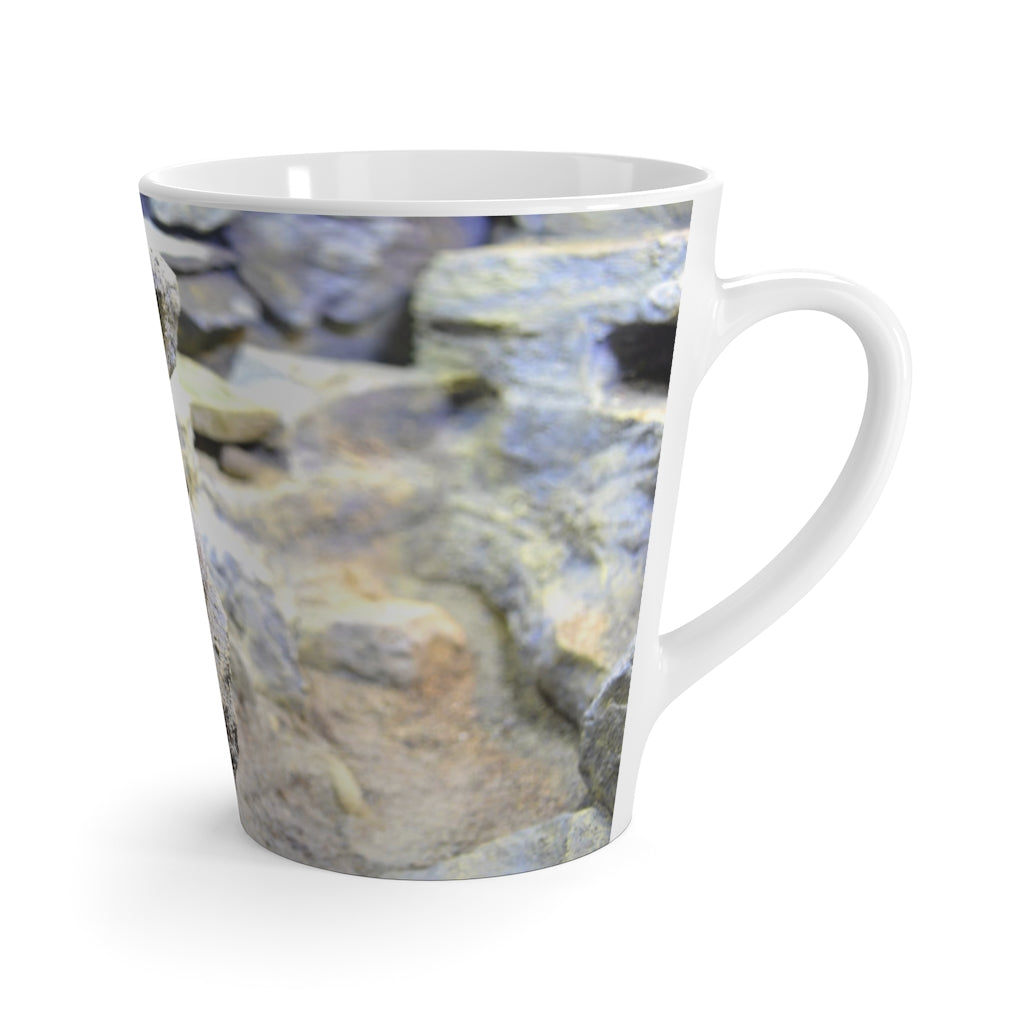 A stylish white ceramic latte mug featuring a unique snake design, perfect for coffee lovers.