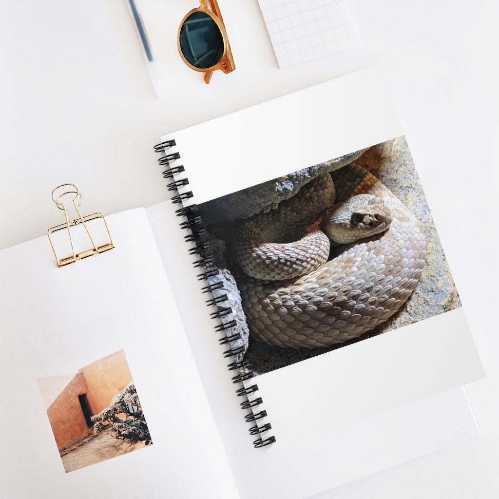 A stylish Snake Spiral Notebook featuring a vibrant snake design on the front cover and ruled line pages inside.
