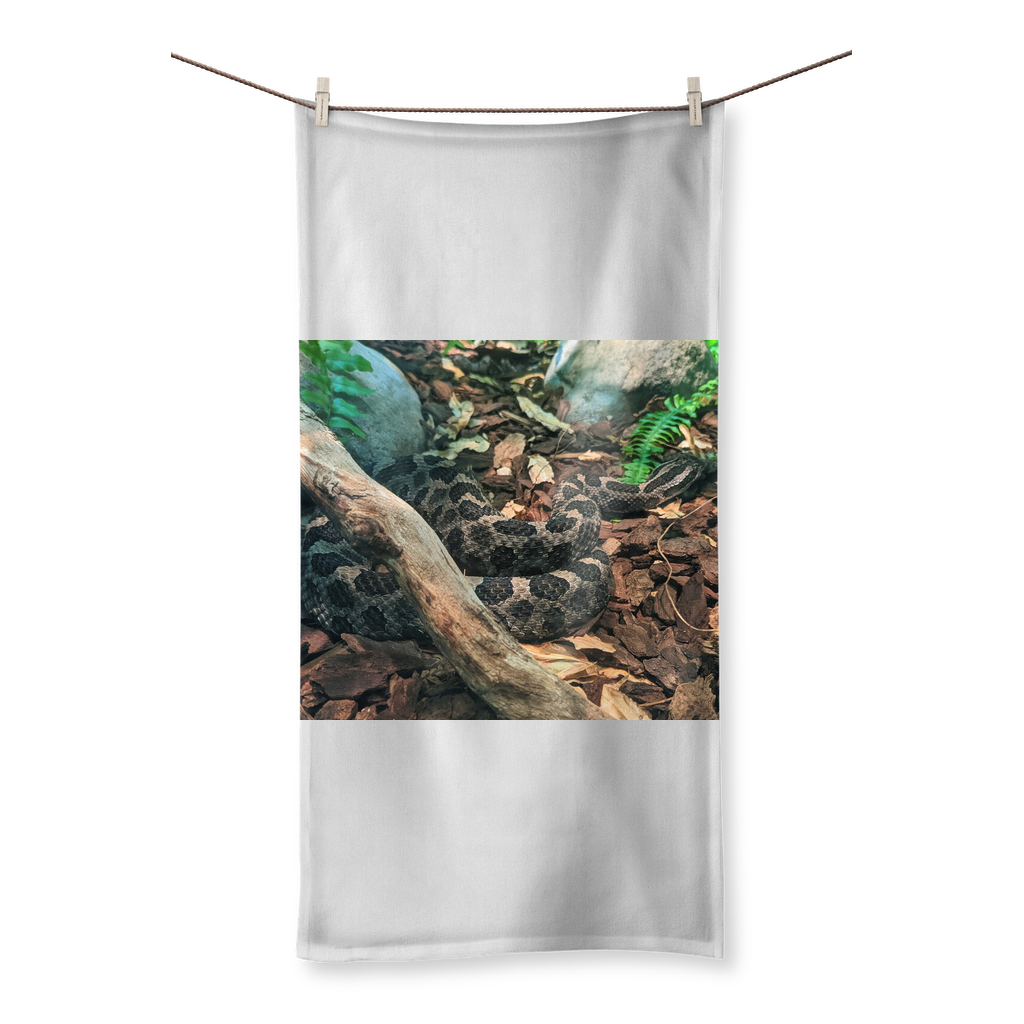 A vibrant Snake Sublimation All Over Towel showcasing colorful designs on one side and soft cotton texture on the other, perfect for beach or bath use.